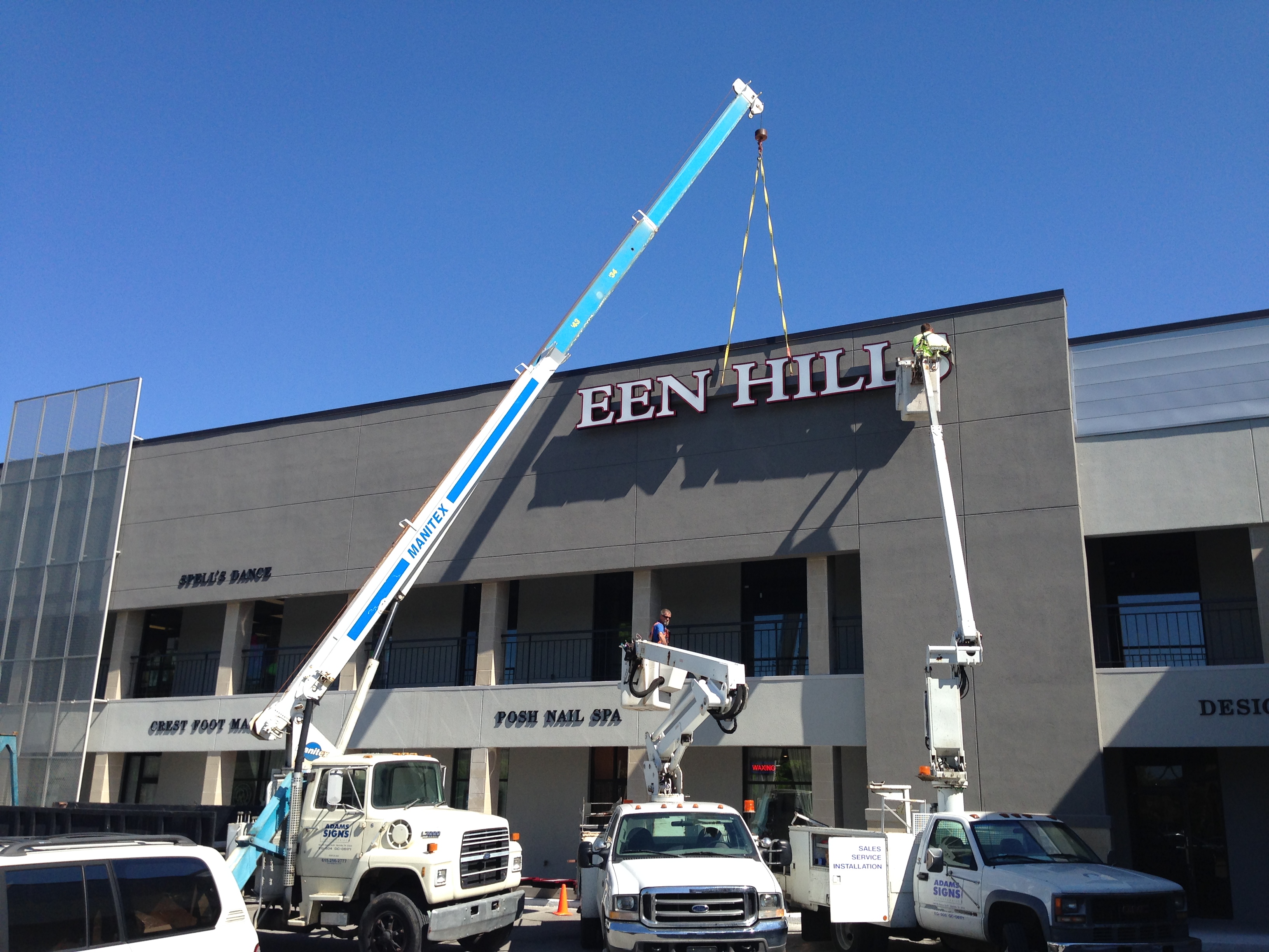 Gallery At Green Hills installation in progress by Adams Signs & Awnings